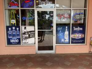 storefront window graphics, representing several different liquor brands