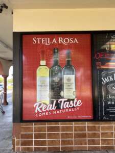 Stella Rosa advertisement featuring bottles of Stella Rosa Moscato D'Asti, Stella Rosa Black, and Stella Rosa Platinum, with the tagline "Real Taste Comes Naturally.